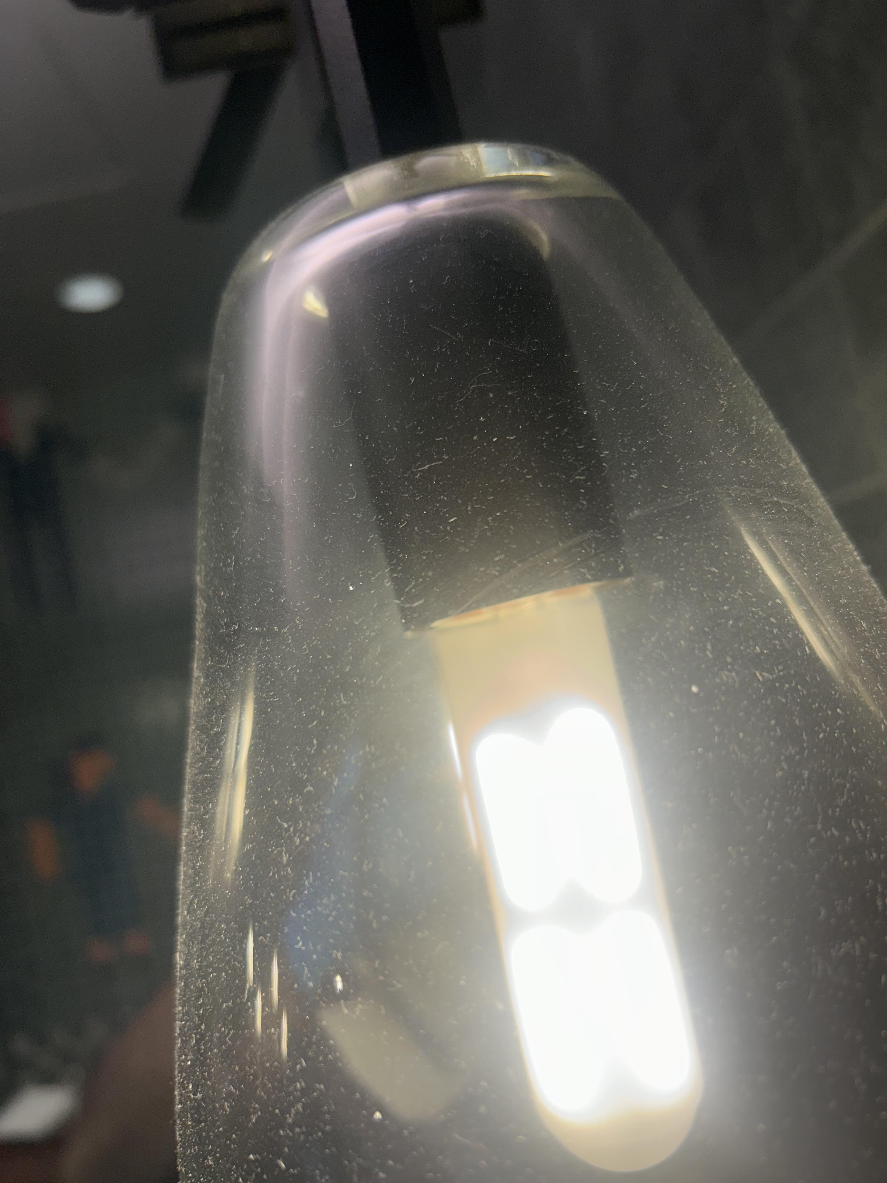Dust on a commercial light fixture before cleaning
